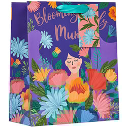 a purple gift bag with flowers and the words blooming mum