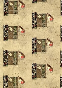 a christmas wrapping paper with a robin on it