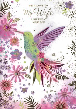 Presenting the 'Wife' birthday card, a truly beautiful design from Simon Elvin, perfect for celebrating that special someone. This exquisite card features a vibrant hummingbird, gracefully depicted amidst a stunning array of pink and purple flowers. Delicate gold accents and sparkling embellishments add a touch of luxury, making it a truly memorable choice for a wife's birthday. The heartfelt message 'WITH LOVE TO My Wife' sets the perfect tone for a cherished greeting. This card offers a wonderful way to express love and appreciation. Available in a convenient pack size of 1x6, it's an ideal addition to your greeting card selection, offering customers a premium option for a beloved wife.