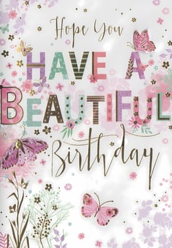 This charming birthday card features a warm message: 'Hope You Have A Beautiful Birthday'. The design showcases an array of colourful butterflies and delicate floral patterns in a soft palette of pinks, purples, and greens. Elegant gold script for 'Hope You' and 'Birthday' is paired with decorative, patterned lettering for 'HAVE A BEAUTIFUL'. Subtle glitter accents add a touch of sparkle, enhancing the celebratory feel. This card is a lovely choice for any female recipient, offering a beautiful way to send birthday wishes.