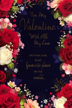 Share a truly romantic message this Valentine's Day with this exquisite card from Simon Elvin. Adorned with a lavish border of vibrant red and soft white roses, delicate pink flowers, and sparkling gold accents on a rich navy background, it's a design that speaks of love. The elegant golden script conveys a heartfelt sentiment: 'For My Valentine With All My Love, BY YOUR SIDE IS MY favourite place IN THE world...'. This 'Open Female' card is ideal for expressing affection to a special woman in your life. Each pack contains 6 beautiful cards, ready to help your customers celebrate love. A classic choice for a cherished Valentine.