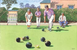 A group of people is playing a game of lawn bowling.