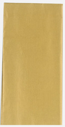 A piece of gold tissue paper is sitting on a white surface.