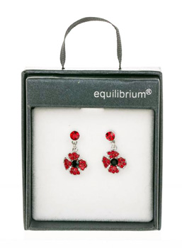 Add a touch of vibrant elegance to any outfit with these beautiful Dangly Poppy Earrings from equilibrium®. Featuring a charming poppy design adorned with sparkling red and black stones, these earrings are sure to catch the eye. The delicate dangle style adds a graceful movement, making them perfect for both everyday wear and special occasions. Each pair comes beautifully presented in a stylish gift box, making them an ideal treat for yourself or a thoughtful present for someone special. A delightful accessory that combines classic symbolism with contemporary sparkle.