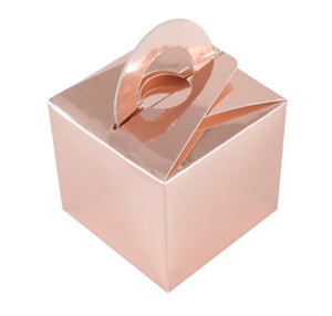 A rose gold box with a handle is on a white background.