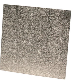 A close-up of a square metal piece on a white background.