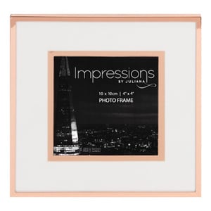 A picture frame that says "Impressions by Juliana" on it.