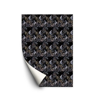 A sheet of paper with a pattern of birds and flowers on it.