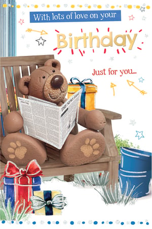 A birthday card with a teddy bear reading a newspaper.