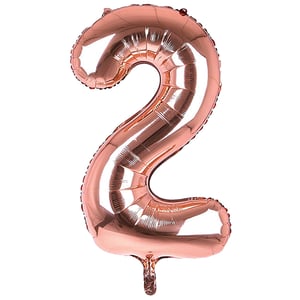 A rose gold balloon in the shape of number 2.