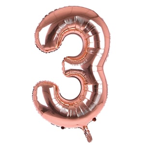 A rose gold balloon in the shape of the number three.