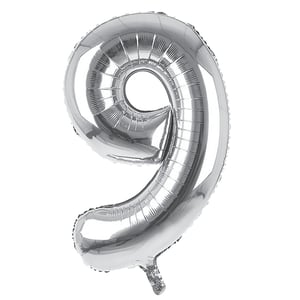 A silver balloon in the shape of number 9.