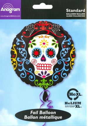 A foil balloon with a sugar skull on it.