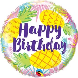 a happy birthday balloon with pineapples and leaves on it