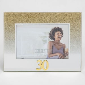 A picture frame with a picture of a woman and the number 30 on it.