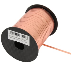 A spool of curling ribbon that is matte metallic.