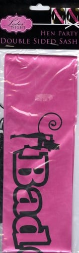 A pink sash with the word "bad" on it.