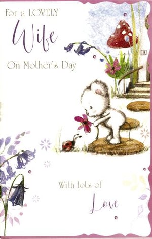 A Mother's Day card with a teddy bear holding a flower.