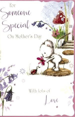 A mother's Day card with a teddy bear holding a flower.
