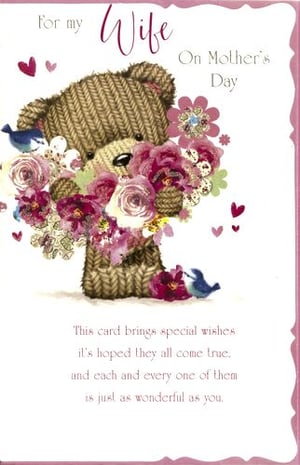 A mother's day card with a teddy bear holding flowers.