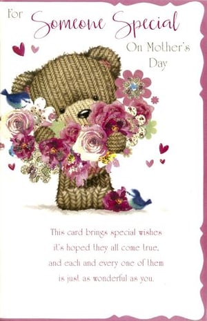 A mother's day card with a teddy bear holding flowers.
