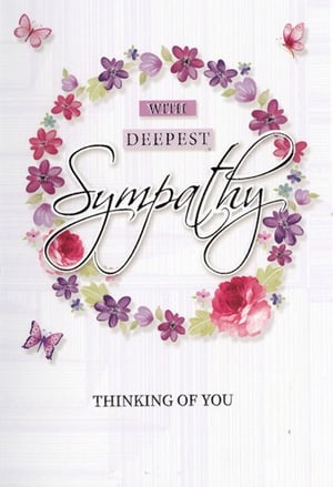 A sympathy card with a wreath of flowers and butterflies.