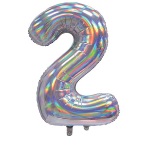 A silver foil balloon is in the shape of the number 2.