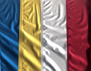 A close-up of a blue, yellow, and red flag.