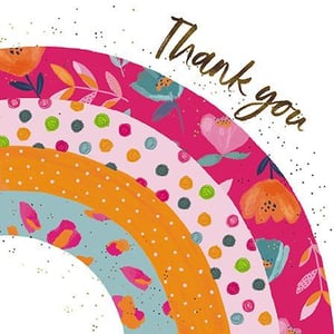 A thank-you card with a rainbow and flowers on it.
