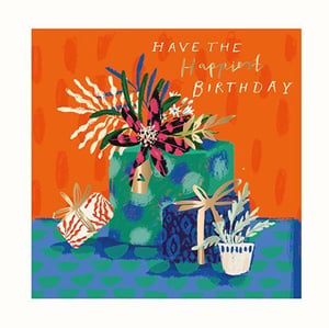 A birthday card with a cake, gifts, and flowers on it.