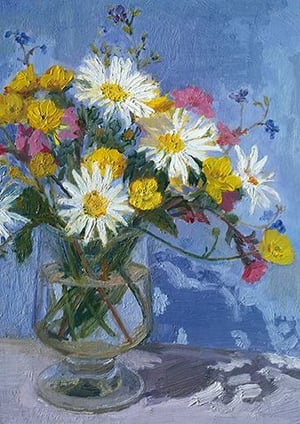 A painting of flowers is in a glass vase on a table.