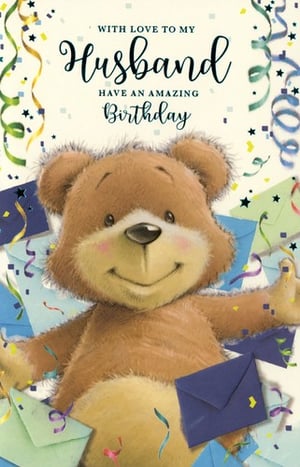 A teddy bear is on a birthday card that says, "With love to my husband. Have an amazing birthday."