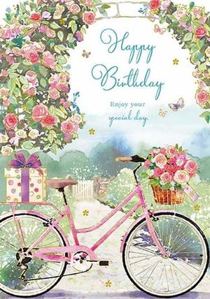 A pink bicycle with a basket of flowers is on a birthday card.
