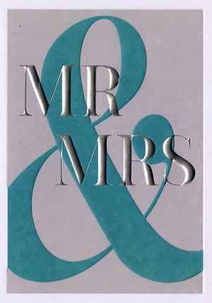A Mr. and Mrs. sign with a blue ribbon.