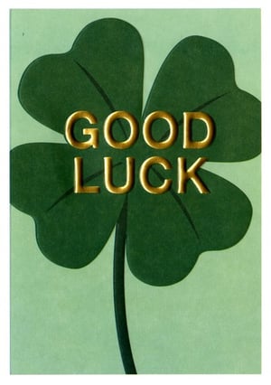 A green clover with the words "good luck" on it.