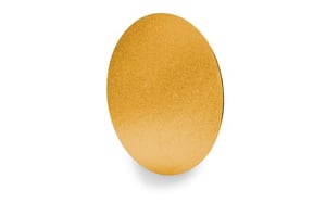 a gold circle is sitting on a white surface .