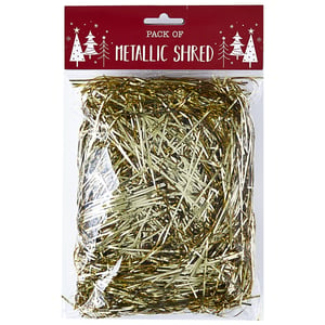 A package of metallic shred with Christmas trees on it.