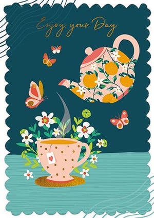 a cup of tea and a teapot on a table with butterflies .