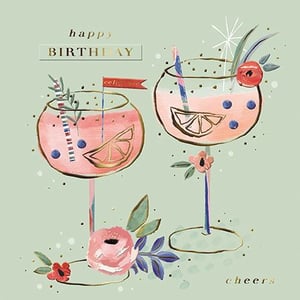 it is a birthday card with a bottle of champagne and two glasses of champagne .