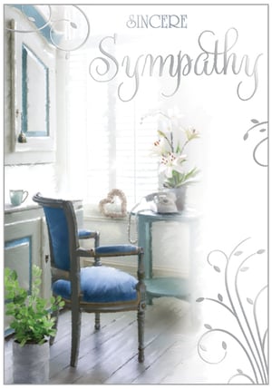 a sympathy card with a blue chair and a table