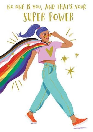a woman wearing a rainbow cape and sunglasses is walking .