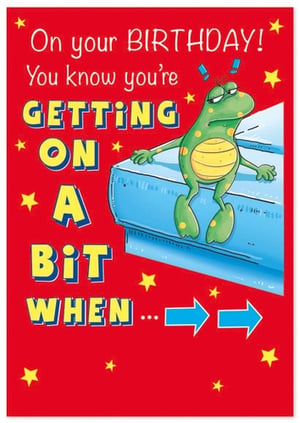 a frog is sitting on a mattress on a birthday card .