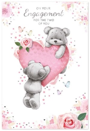 two teddy bears are holding a pink heart on a engagement card .