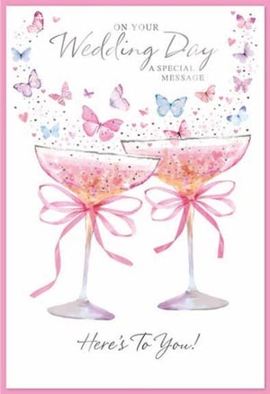 a wedding day card with two champagne glasses decorated with pink bows and butterflies .