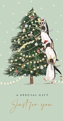 three penguins are decorating a christmas tree on a christmas card .
