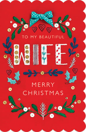 a red christmas card that says to my beautiful wife merry christmas
