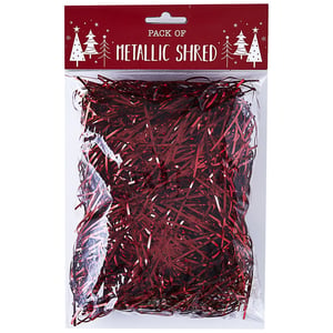 A package of metallic shred with Christmas trees on it.