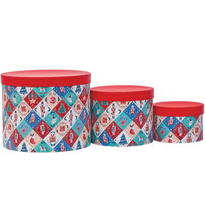 three round boxes with a nutcracker pattern on them
