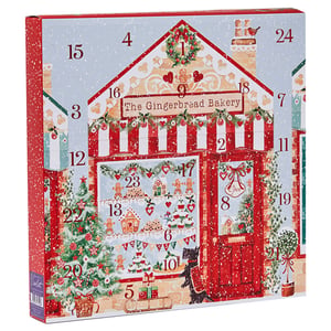 a gingerbread bakery advent calendar with a cat on the door