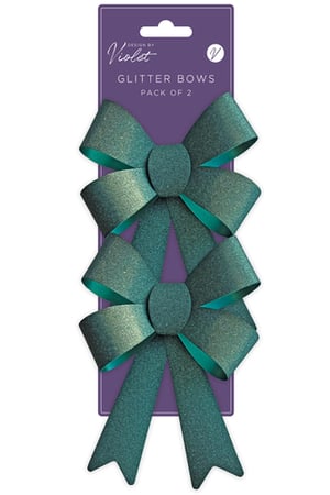 a package of two green glitter bows by violet